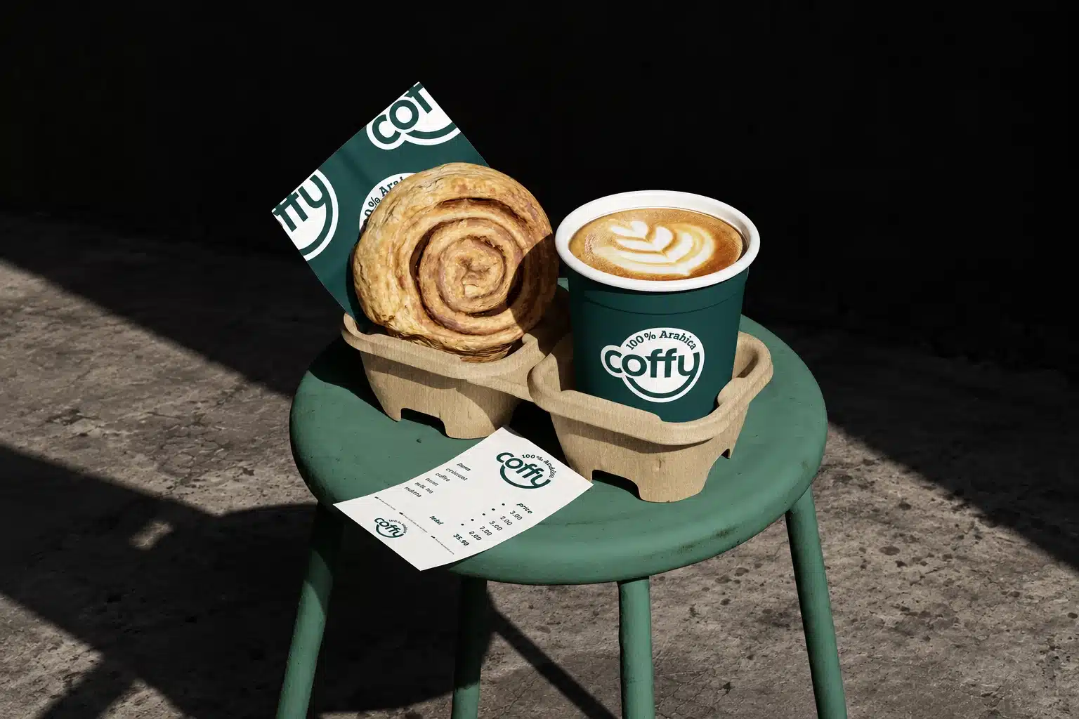 Coffy identity on a coffee cup, pastry sleeve and receipt in a landscape product scene