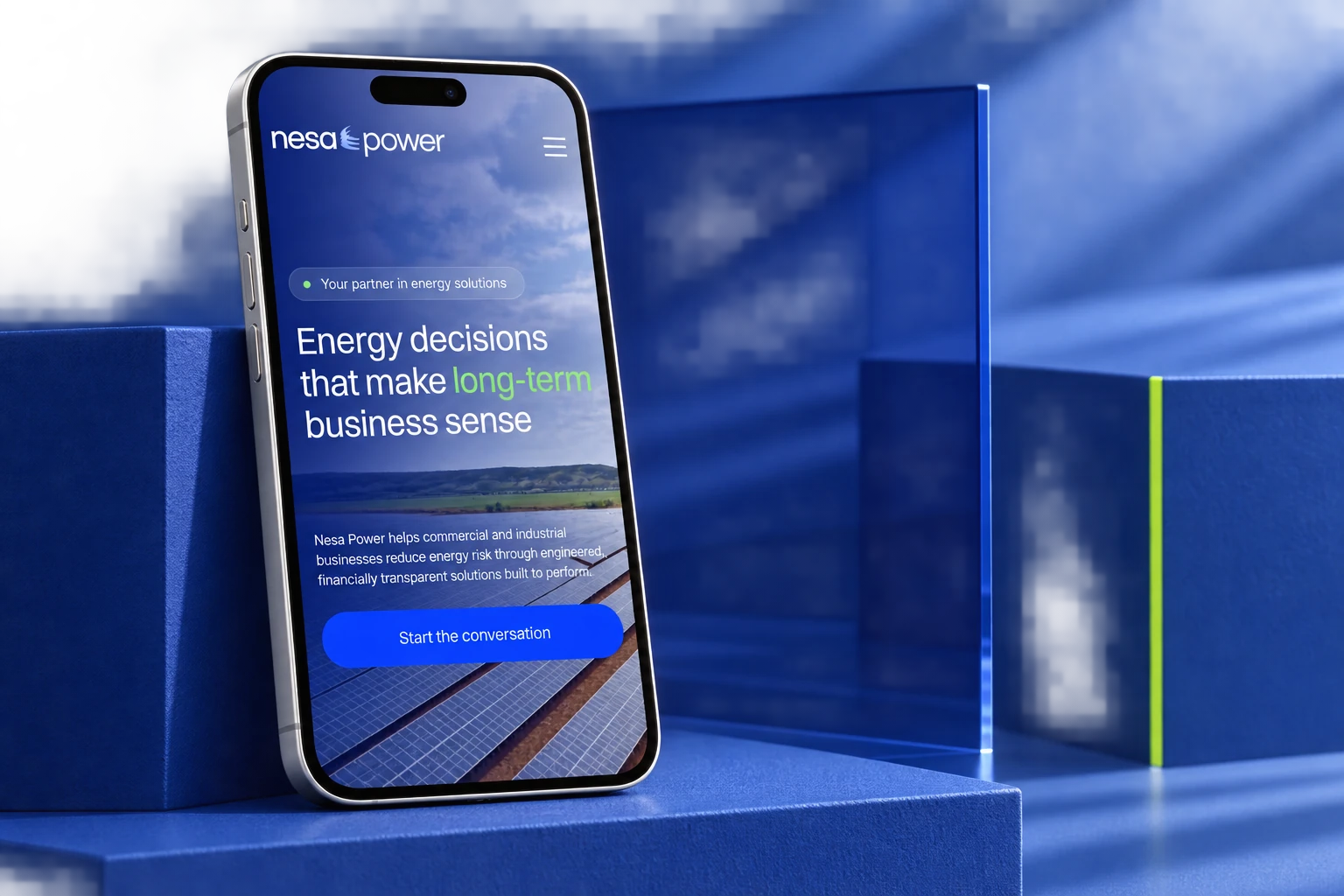 Nesa Power mobile website on an iPhone Pro against cobalt blue architectural forms