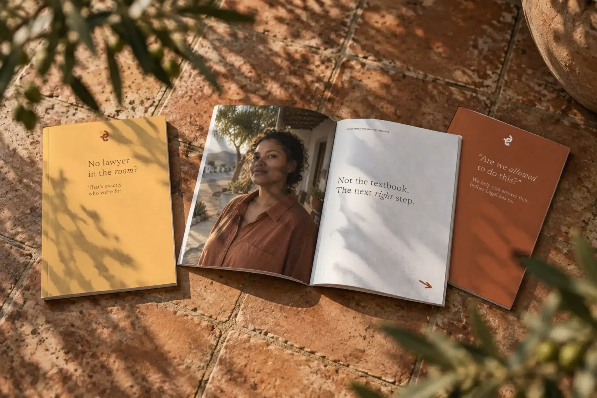 Grounded Compliance printed booklets on clay pavers